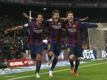 (L-R) Barcelona's Luis Suarez, Neymar and Lionel Messi celebrate a goal