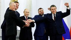 Russian President Vladimir Putin and Denis Pushilin, Leonid Pasechnik, Vladimir Saldo, Yevgeny Balitsky, who are the Russian-installed leaders in Ukraine's Donetsk, Luhansk, Kherson and Zaporizhzhia regions, attend a ceremony to declare the annexation of the Russian-controlled territories of four Ukraine's Donetsk, Luhansk, Kherson and Zaporizhzhia regions, after holding what Russian authorities called referendums in the occupied areas of Ukraine that were condemned by Kyiv and governments worldwide, in the Georgievsky Hall of the Great Kremlin Palace in Moscow, Russia, September 30, 2022. Sputnik/Dmitry Astakhov/Pool via REUTERS ATTENTION EDITORS - THIS IMAGE WAS PROVIDED BY A THIRD PARTY.     TPX IMAGES OF THE DAY