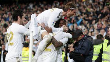 MADRID, SPAIN - MARCH 01: Vinicius Junior of Real Madrid celebrates with teammates Daniel Carvajal, Isco and Sergio Ramos of Real Madrid after scoring his team&#039;s first goal during the Liga match between Real Madrid CF and FC Barcelona at Estadio Santiago Bernabeu on March 01, 2020 in Madrid, Spain. (Photo by Gonzalo Arroyo Moreno/Getty Images)
