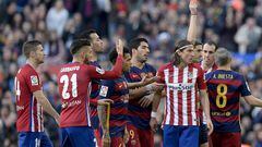 Filipe Luis gets his marching orders after his nasty challenge on Messi