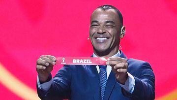 Former Brazilian footballer and World Cup winner Cafu displays the name of Brazil during the draw for the 2022 World Cup in Qatar at the Doha Exhibition and Convention Center on April 1, 2022. (Photo by FRANCK FIFE / AFP)