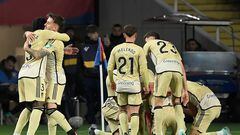 Granada players celebrate their third goal scored by Granada's Spanish defender #14 Ignasi Miquel during the Spanish league football match between FC Barcelona and Granada FC at the Estadi Olimpic Lluis Companys in Barcelona on February 11, 2024. (Photo by Josep LAGO / AFP)
