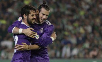 Real Madrid's Isco, left, celebrates with teammate Gareth Bale after scoring against Betis during their La Liga soccer match at the Benito Villamarin stadium, in Seville, Spain on Saturday, Oct. 15, 2016. (AP Photo/Angel Fernandez