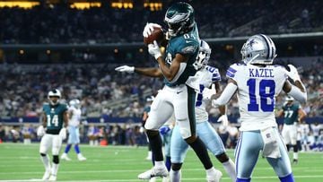 Greg Ward #84 of the Philadelphia Eagles makes a fourth quarter touchdown catch between Damontae Kazee #18 and Jourdan Lewis #26 of the Dallas Cowboys at AT&amp;T Stadium on September 27, 2021 in Arlington, Texas.  