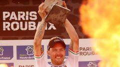 FILE PHOTO: Cycling - Paris-Roubaix - Roubaix, France October 3, 2021  Italy's Sonny Colbrelli celebrates on the podium after winning the race REUTERS/Yves Herman/File Photo