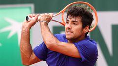 PARIS, FRANCE - JUNE 04: Cristisan Garin of Chile plays a backhand during his Men&#039;s Singles third round match against Marcos Giron of USA during day six of the 2021 French Open at Roland Garros on June 04, 2021 in Paris, France. (Photo by Julian Finney/Getty Images)