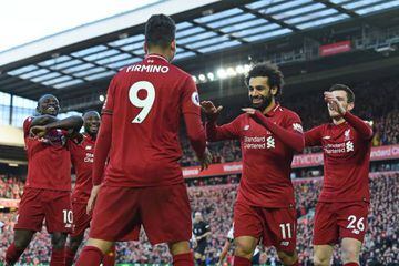 Liverpool's Mohamed Salah celebrates with teammates