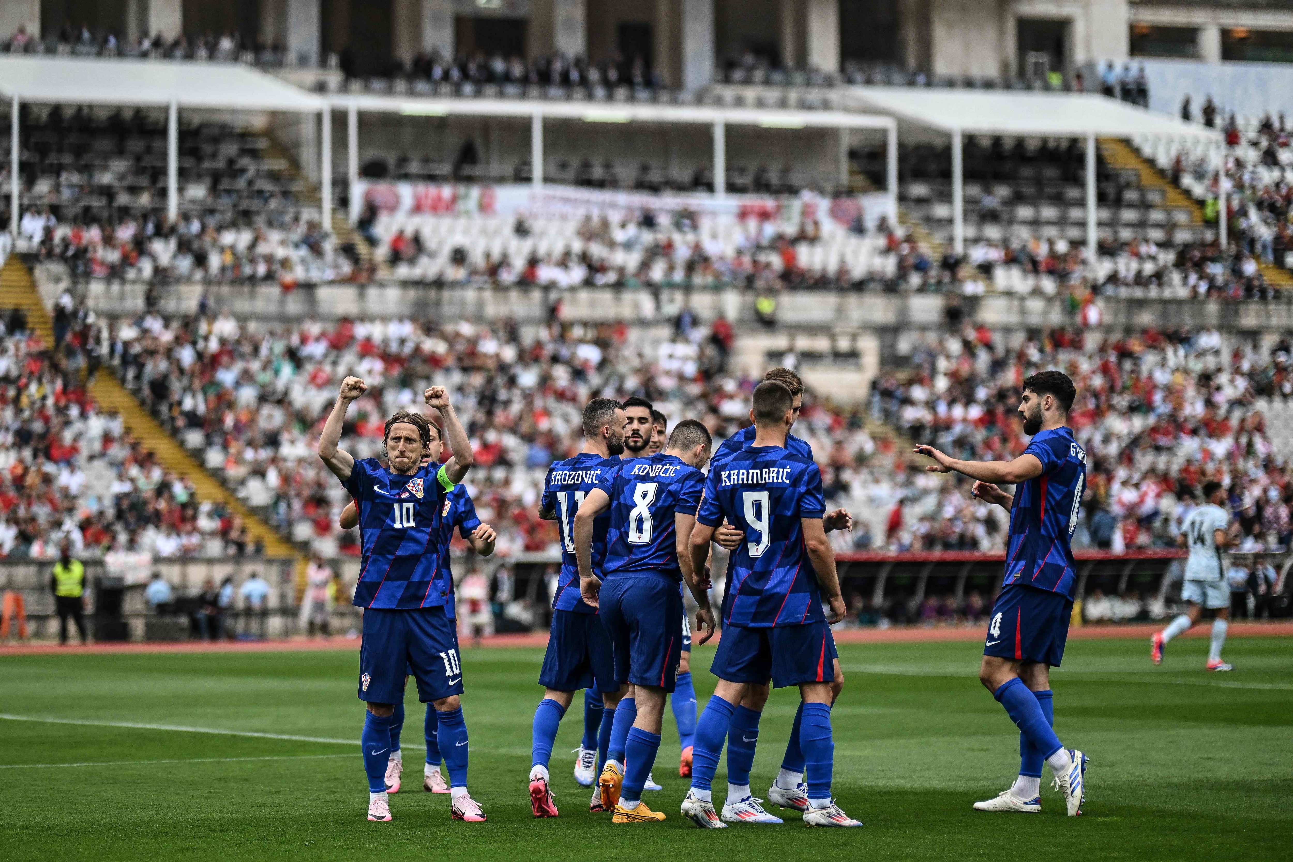 Croatia�s midfielder #10 Luka Modric celebrates after scoring his team's first goal during the international friendly football match between Portugal and Croatia at Jamor stadium in Oeiras on June 8, 2024. (Photo by PATRICIA DE MELO MOREIRA / AFP)