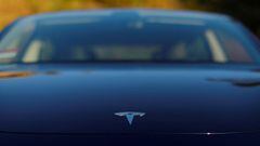 FILE PHOTO: A 2018 Tesla Model 3 electric vehicle is shown in this photo illustration taken in Cardiff, California, U.S., June 1, 2018. REUTERS/Mike Blake/File Photo