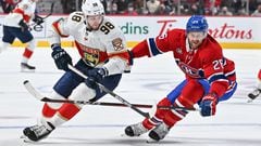 MONTREAL, QC - APRIL 29: Maxim Mamin #98 of the Florida Panthers skates the puck against Jeff Petry #26 of the Montreal Canadiens during the first period at Centre Bell on April 29, 2022 in Montreal, Canada.   Minas Panagiotakis/Getty Images/AFP
== FOR NEWSPAPERS, INTERNET, TELCOS & TELEVISION USE ONLY ==