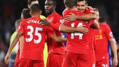 Goalscorers Jordan Henderson (14) and Dejan Lovren of Liverpool (6) celebrate victory after the Premier League match between Chelsea and Liverpool at Stamford Bridge on September 16, 2016