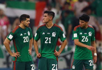 Soccer Football - FIFA World Cup Qatar 2022 - Group C - Saudi Arabia v Mexico - Lusail Stadium, Lusail, Qatar - December 1, 2022 Mexico's Henry Martin, Uriel Antuna and Kevin Alvarez look dejected after being eliminated from the World Cup REUTERS/Kai Pfaffenbach