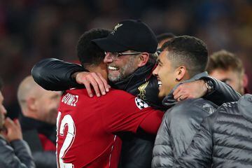 LIVERPOOL, ENGLAND - MAY 07:  Jurgen Klopp, Manager of Liverpool, Joe Gomez and Roberto Firmino celebrate after the UEFA Champions League Semi Final second leg match between Liverpool and Barcelona at Anfield on May 07, 2019 in Liverpool, England. (Photo 