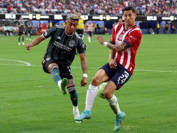 Julián Araujo of LA Galaxy attempts to clear a ball against Chivas.