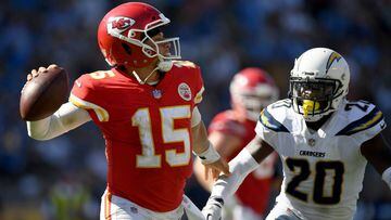 CARSON, CA - SEPTEMBER 09:  Patrick Mahomes #15 of the Kansas City Chiefs fends off the rush of Desmond King #20 of the Los Angeles Chargers during the fourth quarter in a 38-28 Chiefs win at StubHub Center on September 9, 2018 in Carson, California.  (Photo by Harry How/Getty Images)