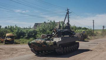 LUHANSK, UKRAINE - JUNE 6: An Ukrainian soldier drives tank on a road in Luhansk, Ukraine on June 6, 2022. (Photo by Diego Herrera Carcedo/Anadolu Agency via Getty Images)