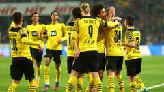 COLOGNE, GERMANY - MARCH 20: Marius Wolf of Borussia Dortmund celebrates with teammates after scoring their team&#039;s first goal during the Bundesliga match between 1. FC K&ouml;ln and Borussia Dortmund at RheinEnergieStadion on March 20, 2022 in Cologn