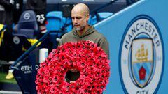 MANCHESTER, ENGLAND - NOVEMBER 12: Pep Guardiola, Manager of Manchester City lays a Armistice Day poppy wreath prior to the Premier League match between Manchester City and Brentford FC at Etihad Stadium on November 12, 2022 in Manchester, England. (Photo by Lynne Cameron - Manchester City/Manchester City FC via Getty Images)