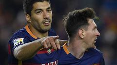 Luis Suarez celebrates with Lionel Messi 