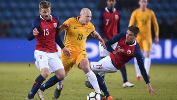 OSLO, NORWAY - MARCH 23:  Aaron Moy of Australia in action with Fredrik Midtsjo of Norway (L) and Markus Henriksen of Norway (R) during the International Friendly match between Norway and Australia at Ullevaal Stadion on March 23, 2018 in Oslo, Norway.  (