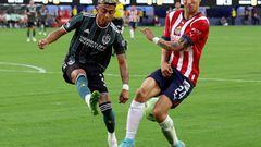 INGLEWOOD, CALIFORNIA - AUGUST 03: Julian Araujo #2 of Los Angeles Galaxy attempts a clear off Carlos Cisneros #24 of Guadalajara Chivas during the Leagues Cup Showcase 2022 at SoFi Stadium on August 03, 2022 in Inglewood, California.   Harry How/Getty Images/AFP
== FOR NEWSPAPERS, INTERNET, TELCOS & TELEVISION USE ONLY ==