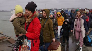 Ukranians who fled the conflict get off a ferry at the border crossing in Romania, on March 7, 2022 in Isaccea, Romania.