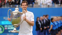 Queens Club, London - 19/6/16. Great Britain's Andy Murray celebrates with the trophy after victory in the final.