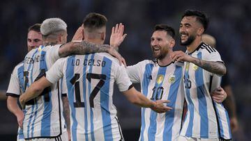 Argentina's midfielder Enzo Fernandez (L) celebrates with (L to R) midfielder Giovani Lo Celso, forward Lionel Messi and forward Nicolas Gonzalez after scoring against Curacao during the friendly football match between Argentina and Curacao at the Madre de Ciudades stadium in Santiago del Estero, in northern Argentina, on March 28, 2023. (Photo by JUAN MABROMATA / AFP)