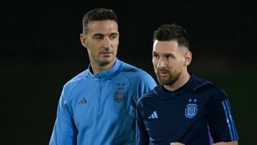 (FILES) Argentina's coach Lionel Scaloni (L) and Argentina's forward Lionel Messi take part in a training session at Qatar University in Doha on December 8, 2022, on the eve of the Qatar 2022 World Cup quarter-final football match between The Netherlands and Argentina. The Argentine Football Association (AFA) announced on February 22, 2024, that it will play two friendly matches in the United States during the international window next March, instead of the friendlies initially scheduled for the same dates in China. (Photo by Juan MABROMATA / AFP)