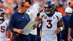 Denver Broncos head coach Sean Payton talks with quarterback Russell Wilson (3)