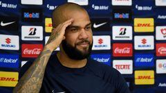 Brazilian international football star Dani Alves gestures after signing his contract with Mexico's Pumas for the current Apertura-2022 tournament, at the team instalations in the National Autonomous University of Mexico, in Mexico City on July 23, 2022. (Photo by ALFREDO ESTRELLA / AFP)
