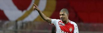 File photo taken on December 14, 2016 shows Monaco's French forward Kylian Mbappe Lottin celebrating after scoring his first hat-trick as a professional football player during the French League Cup football match between Monaco and Rennes