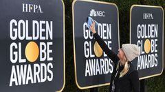 (FILES) In this file photo taken on January 05, 2019 workers and staff prepare the red carpet area for Sunday&#039;s the 76th Golden Globe Awards, at the Beverly Hilton hotel in Beverly Hills, California. - Hollywood&#039;s awards season kicks into high g