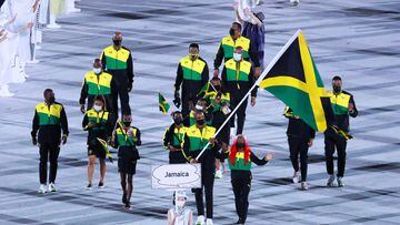 TOKYO, JAPAN - JULY 23: Flag bearers Shelly-Ann Fraser-Pryce and Ricardo Brown of Team Jamaica take part in the Parade of Nations during the Opening Ceremony of the Tokyo 2020 Olympic Games at Olympic Stadium on July 23, 2021 in Tokyo, Japan. (Photo by Lu