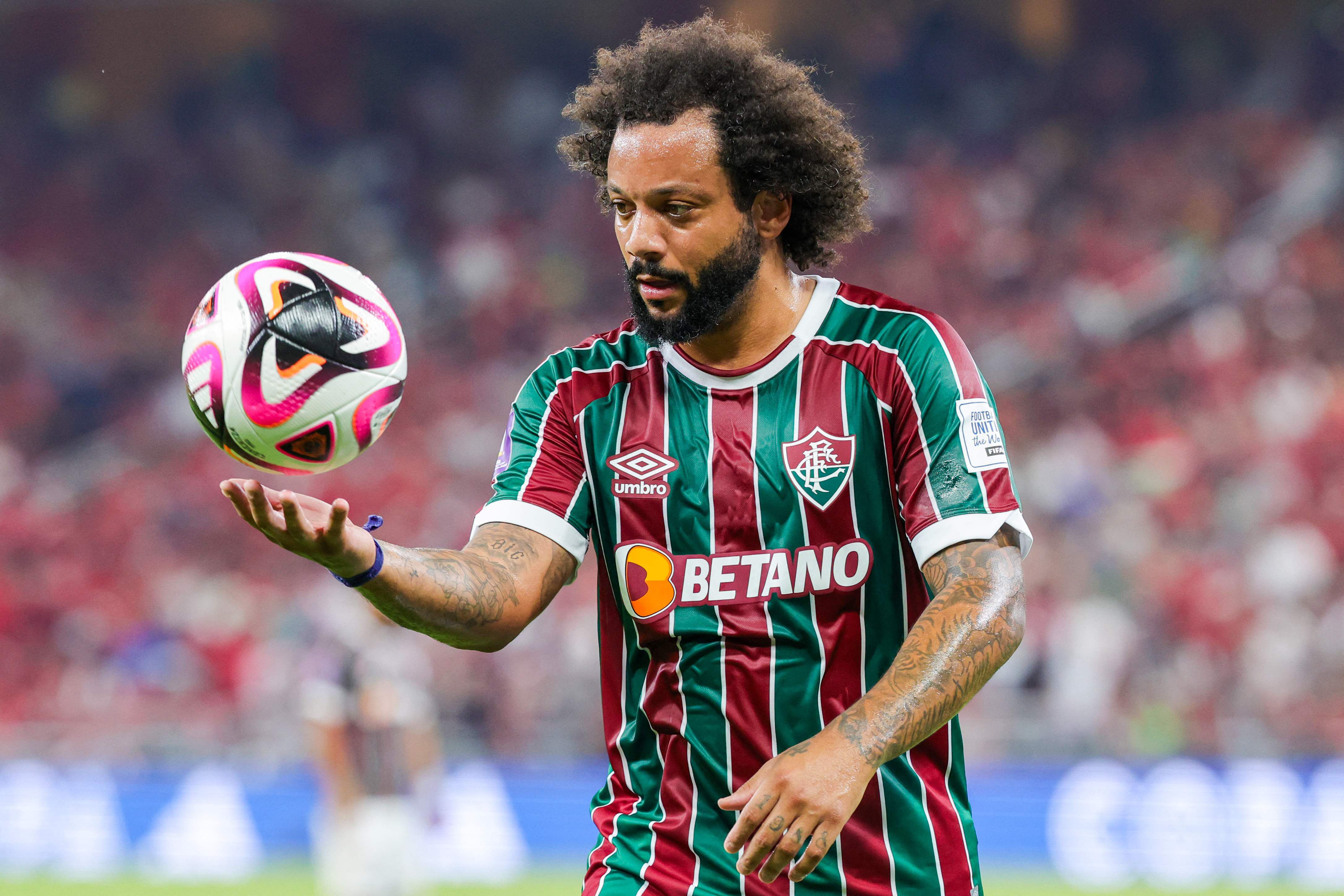 Fluminense's Brazilian defender #12 Marcelo holds the ball during the FIFA Club World Cup football semi-final match between Brazil's Fluminense and Egypt's Al-Ahly at King Abdullah Sports City in Jeddah on December 18, 2023. (Photo by Giuseppe CACACE / AFP)