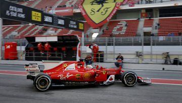 Ferrari driver Sebastian Vettel of Germany leaves the team box during a Formula One pre-season testing session at the Catalunya racetrack in Montmelo, outside Barcelona, Spain, Thursday, March 9, 2017. (AP Photo/Francisco Seco)