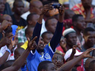 An Everton supporter takes a picture before a friendly between Everton and Kenya's Gor Mahia.