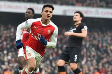 Arsenal's Chilean striker Alexis Sanchez celebrates after scoring their second goal from the penalty spot during the English Premier League football match between Arsenal and Hull City at the Emirates Stadium in London on February 11, 2017. 
Arsenal won the game 2-0. / AFP PHOTO / Glyn KIRK / RESTRICTED TO EDITORIAL USE. No use with unauthorized audio, video, data, fixture lists, club/league logos or 'live' services. Online in-match use limited to 75 images, no video emulation. No use in betting, games or single club/league/player publications.  / 
