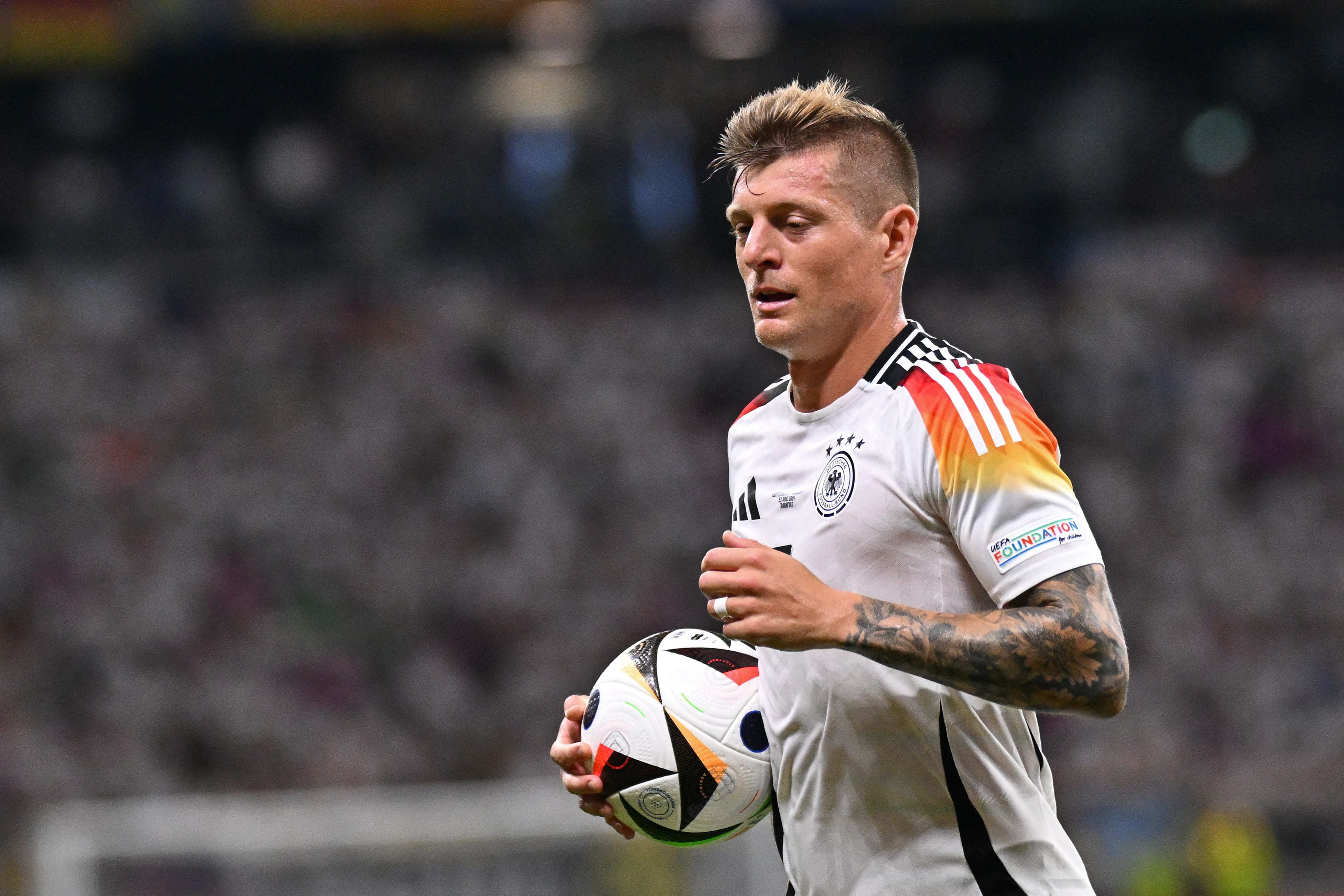 Germany's midfielder #08 Toni Kroos reacts during the UEFA Euro 2024 Group A football match between Switzerland and Germany at the Frankfurt Arena in Frankfurt am Main on June 23, 2024. (Photo by Kirill KUDRYAVTSEV / AFP)