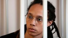 WNBA star and two-time Olympic gold medalist Brittney Griner sits in a cage at a court room prior to a hearing, in Khimki, Russia.