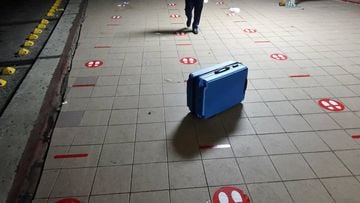 HAVANA, CUBA - JULY 31: An empty and broken suitcase stands left behind where the line for a flight from Havana to Ghana was, amidst stickers on the ground that mark the indicated social distancing, on July 31, 2020, in Havana, Cuba. Cuba has announced th