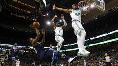 Jan 5, 2018; Boston, MA, USA; Minnesota Timberwolves guard Jimmy Butler (23) tries to shoot over Boston Celtics forward Al Horford (42) and guard Jaylen Brown (7) while falling during the first half at TD Garden. Mandatory Credit: Winslow Townson-USA TODAY Sports