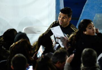 Real Madrid's Brazilian midfielder Casemiro signs autographs to fans during a public training session at the Ciudad Real Madrid training ground in Valdebebas, Madrid, on December 30, 2019. (Photo by OSCAR DEL POZO / AFP)