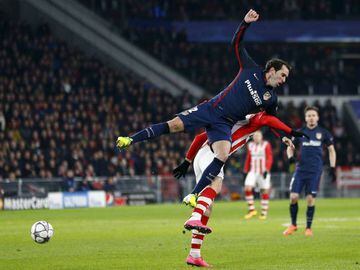 UEFA Champions League Round of 16 First Leg - PSV stadium, Eindhoven, Netherlands - 24/2/16 Atletico Madrid's Diego Godin in action against PSV Eindhoven's Gaston Pereiro (Down).