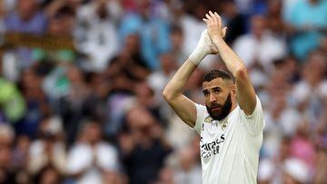 (FILES) Real Madrid's French forward Karim Benzema applauds as he is substituted during the Spanish league football match between Real Madrid CF and Athletic Club Bilbao at the Santiago Bernabeu stadium in Madrid on June 4, 2023. Real Madrid's Ballon d'Or winner Karim Benzema has signed to join Saudi Arabia's Al-Ittihad for three years starting next season, a source in the Jeddah-based club told AFP on June 6. (Photo by Pierre-Philippe MARCOU / AFP)
