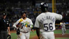 ST PETERSBURG, FLORIDA - AUGUST 11: Isaac Paredes #17 of the Tampa Bay Rays is congratulated by Randy Arozarena #56 after Paredes hit a two-run go-ahead homer against the Cleveland Guardians at Tropicana Field on August 11, 2023 in St Petersburg, Florida.   Mark Taylor/Getty Images/AFP (Photo by MARK TAYLOR / GETTY IMAGES NORTH AMERICA / Getty Images via AFP)