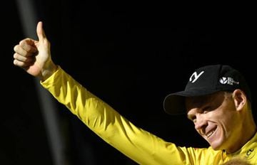 Great Britain's Christopher Froome thumbs up as he celebrates his overall leader yellow jersey on the podium at the end of the 181,5 km fourteenth stage of the 104th edition of the Tour de France cycling race on July 15, 2017 between Blagnac and Rodez.