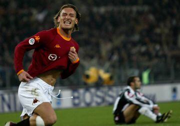 AS Roma's Francesco Totti runs away in celebration passed Juventus' Paolo Montero.