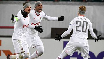 Lokomotiv Moscow&#039;s midfielder from Russia Igor Denisov (L) and Lokomotiv Moscow&#039;s forward from Brazil Ari (C) and Lokomotiv Moscow&#039;s midfielder from Russia Vladislav Ignatyev (R) celebrate after a goal during the round of 32 second leg UEFA