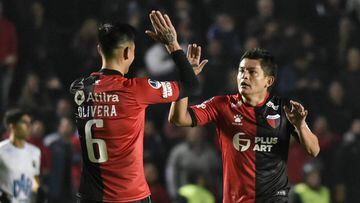 (FILES) In this file photo taken on August 15, 2019, Argentina&#039;s Colon de Santa Fe Luis Maria Rodriguez (R) celebrates with teammate Emanuel Olivera after scoring against Venezuela&#039;s Zulia FC during their Copa Sudamericana quarter-final second leg match at the Brigadier General Estanislao Lopez stadium in Santa Fe, some 470 km north of Buenos Aires. (Photo by MARCELO MANERA / AFP)
